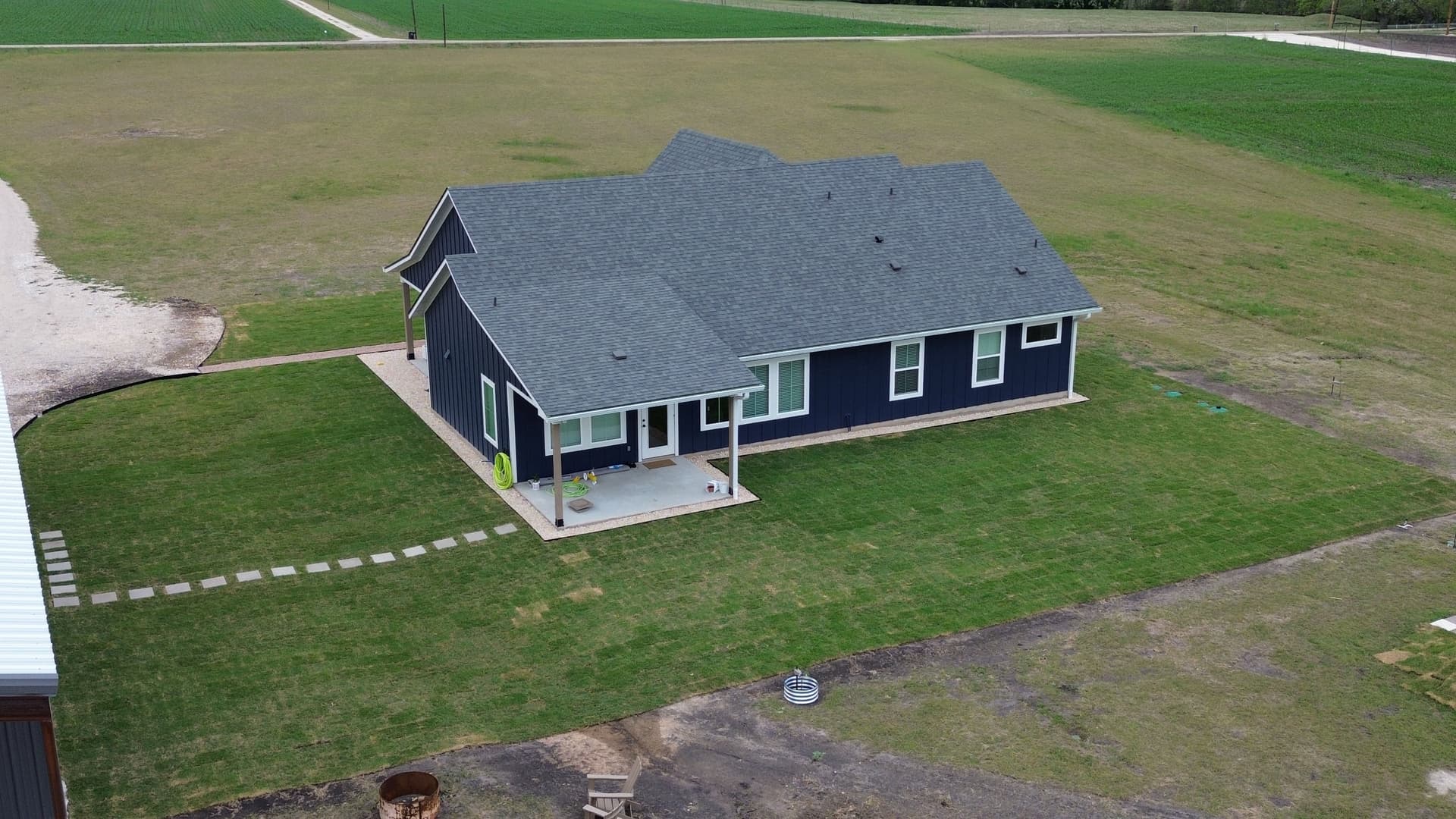 Gallery photos for Fresh Sod Rock Beds and Retaining Walls Around a Full Home: Image #2