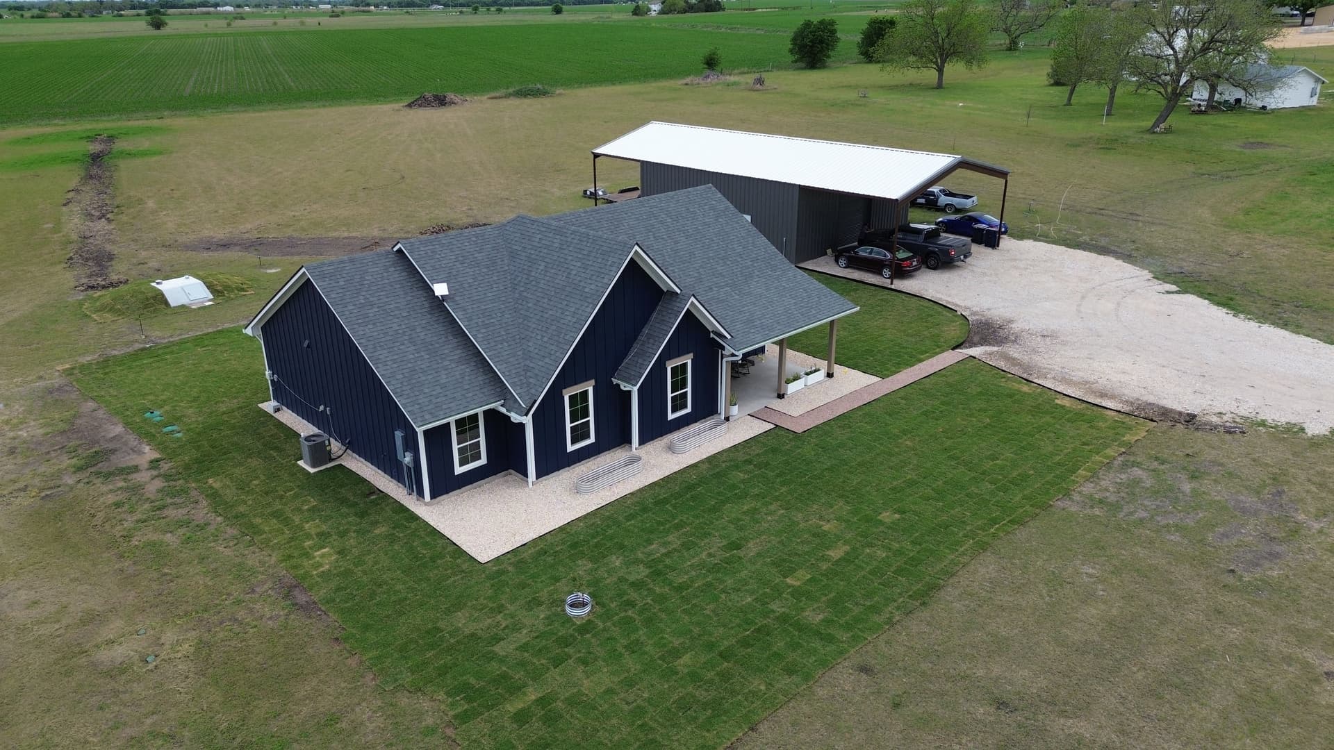 Gallery photos for Fresh Sod Rock Beds and Retaining Walls Around a Full Home: Image #1