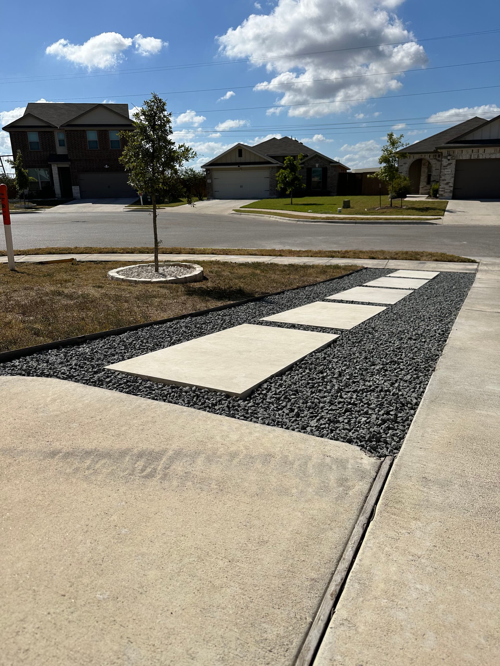 Limestone Paver Walkway with Black Star Gravel and Xeriscape Beds image