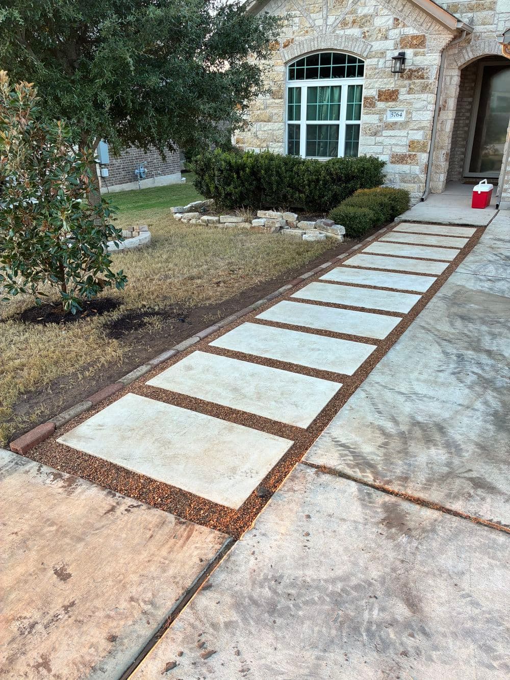Stunning Walkway Upgrade with Pavers and Pea Gravel in Round Rock