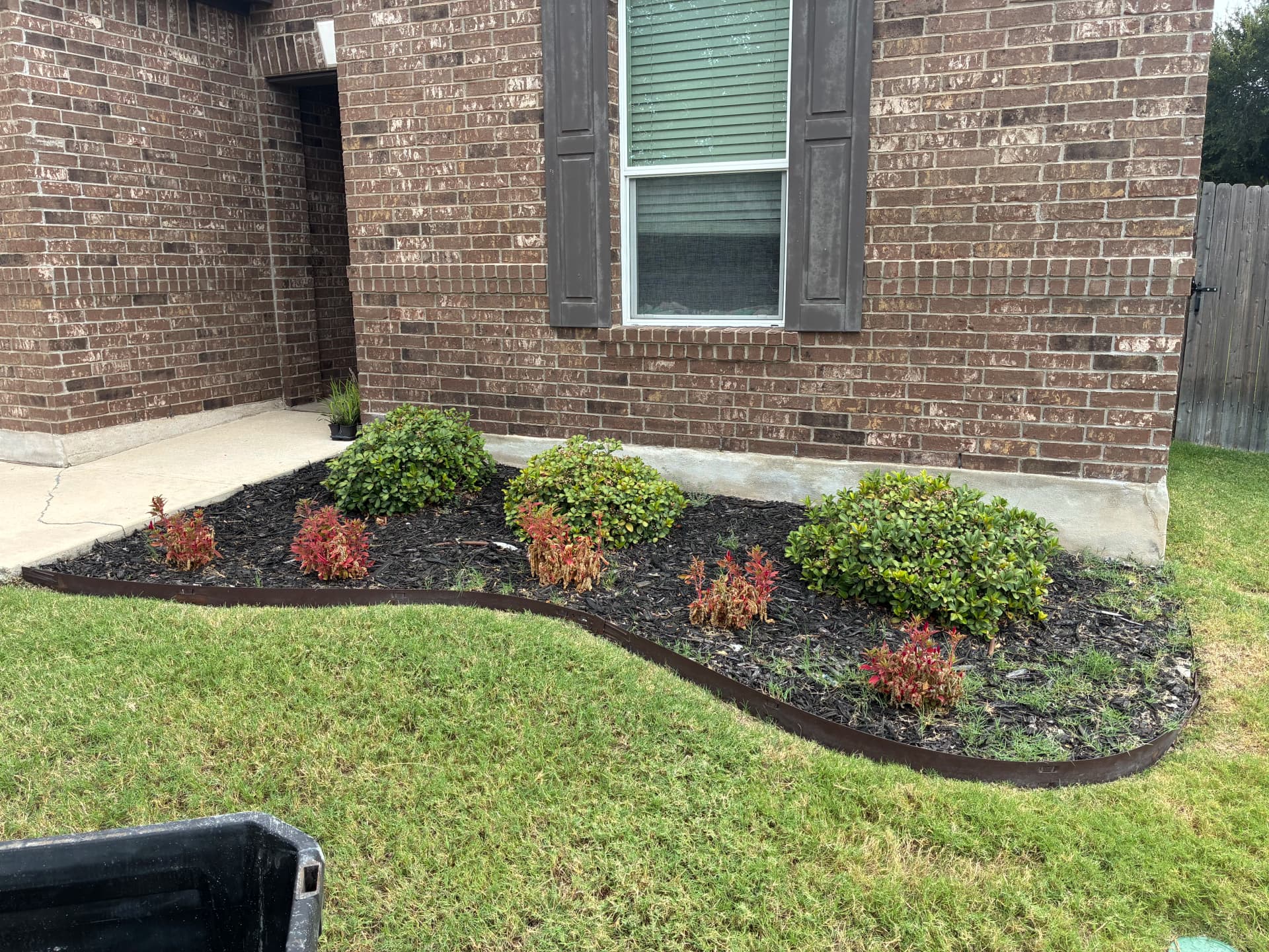 Fresh Mulch, Clean Edges, and Rock Work That Actually Cuts Upkeep image